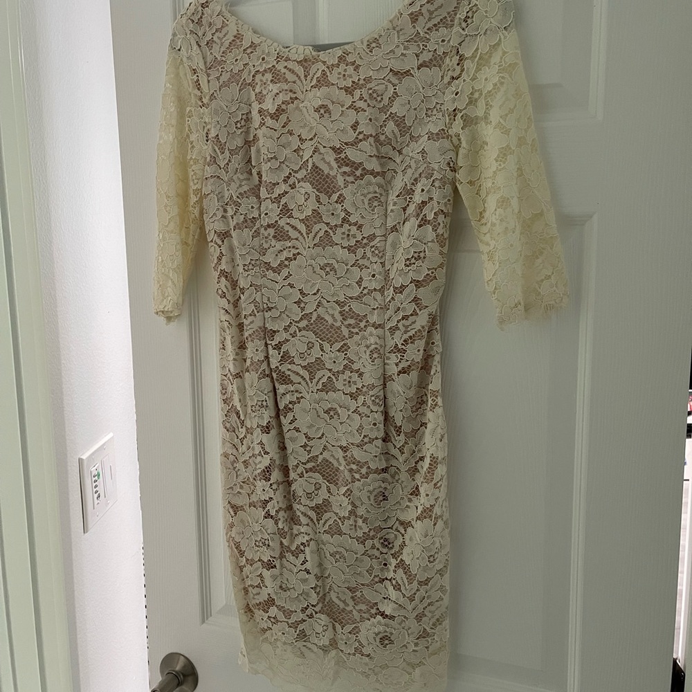 Cream color lace dress. Never been worn. Pristine condition